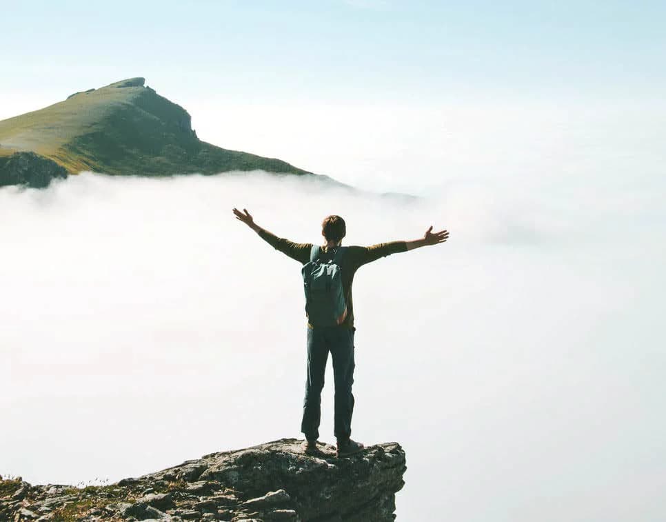 Hiker above the clouds – a Holysama image